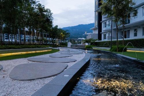 a pond with rocks in the middle of a street at Windmill Upon Hills Premium Suite By Rapi Stay in Genting Highlands