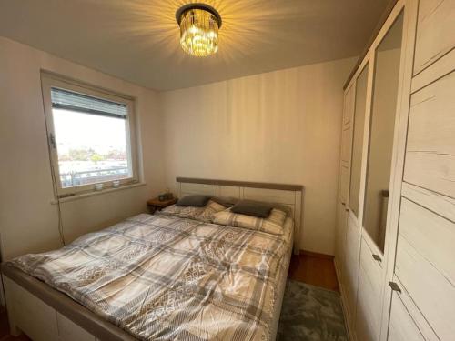 מיטה או מיטות בחדר ב-Zentrales City Apartment