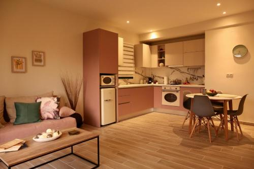 a living room with a couch and a table at Apidalos Apartments in Corfu Town