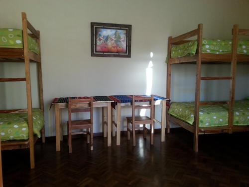 Кровать или кровати в номере Villa Oropeza Hostel