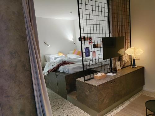 Katil atau katil-katil dalam bilik di Suite Erasmus
