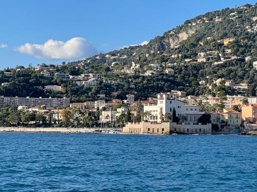 a view of a city from the water at Ezevacances Studio Capuccino vue mer 5 mn plage 7 mn gare Wifi in Èze