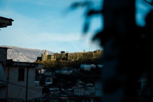 a view of a castle on top of a city at CastleView Inn in Gjirokastër