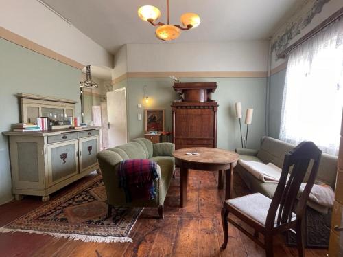 a living room with a couch and a table at Spurensucher Quartier in Usedom Town