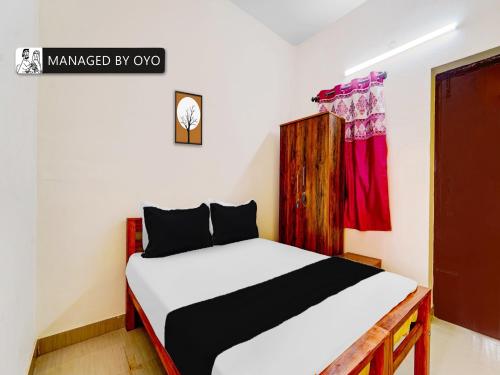 Tempat tidur dalam kamar di OYO Okkilipalayam
