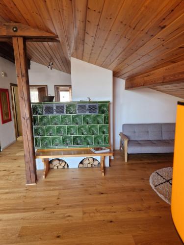 a living room with a couch and a table at Chalet Chiemgau 90 qm 3 Zimmer Balkon in Übersee