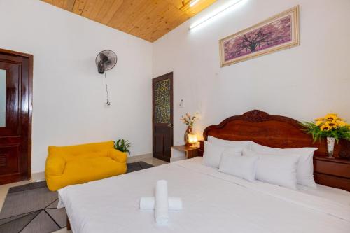 Ένα ή περισσότερα κρεβάτια σε δωμάτιο στο Homestay Biển Xanh