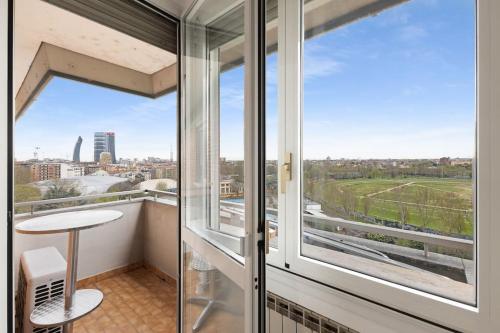 a balcony with a view of a city at Allianz House - Panoramic San Siro cozy house in Milan