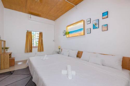 Ένα ή περισσότερα κρεβάτια σε δωμάτιο στο Homestay Biển Xanh