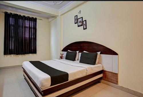 a bedroom with a large bed in a room at AK VILAS - BEST BUDGETED HOTEL IN JAIPUR in Jaipur