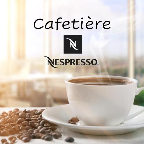 a cup of coffee on a plate with coffee beans at Petite Anita - Centre ville - Parking privé in Barcelonnette