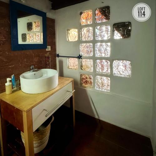 a bathroom with a sink and some glass windows at LOFT-114 in Santa Cruz de Tenerife