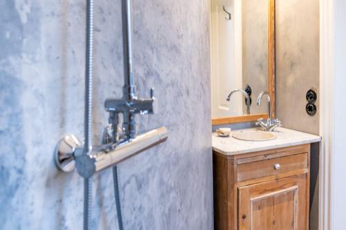 a bathroom with a shower and a sink at Møllehusets Bed & Breakfast in Nordborg