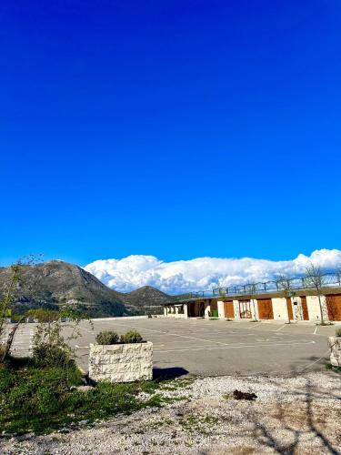 an empty parking lot with mountains in the background at Martina in Cetinje