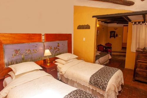 Ένα ή περισσότερα κρεβάτια σε δωμάτιο στο Hotel La Posada de San Antonio