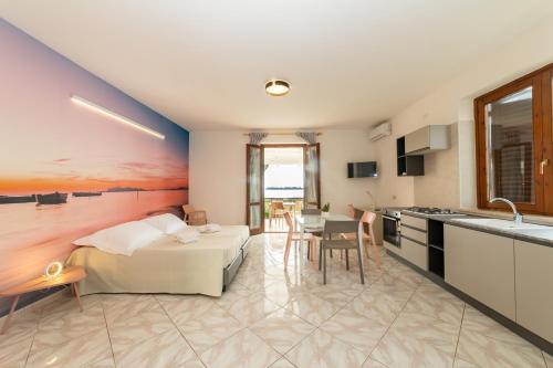 a large room with a bed and a kitchen at Resort Santa Maria Hotel in Birgi Vecchi