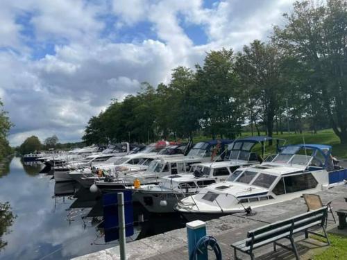 a bunch of boats docked at a marina at St Johns old Schoolhouse in Lecarrow