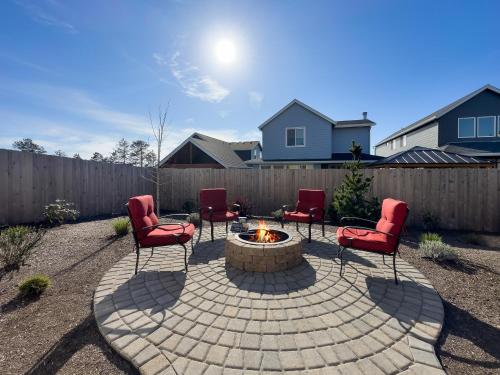 a group of chairs and a fire pit in a backyard at Red Door MCA#50500 in Manzanita