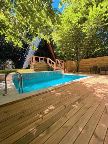 a house with a pool and a water slide at Chalet Sapanca in Sakarya