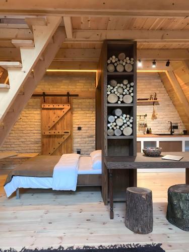 a room with a bed in a wooden house at Chalet Sapanca in Sakarya