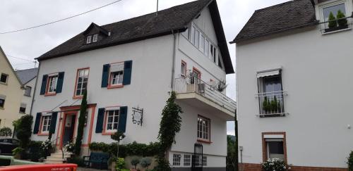 a white building with a black roof at Landhauskiebel in Erden