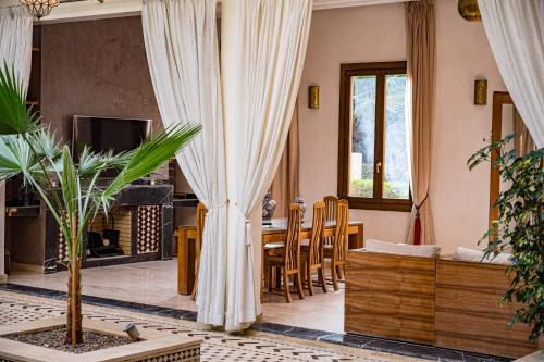 a living room with a couch and a table at Riad Tonaroz in Marrakech