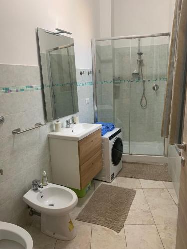 a bathroom with a sink toilet and a shower at L'appartamentino in Montefiascone