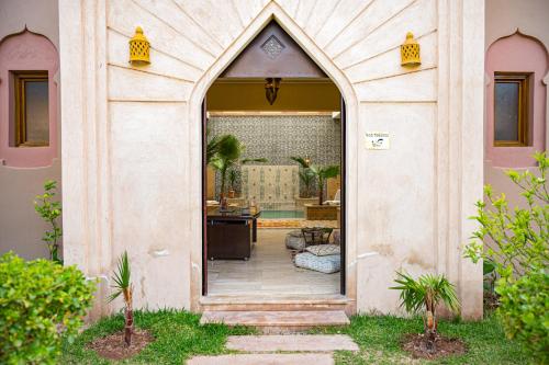 an entrance to a house with an open door at Riad Tonaroz in Marrakech