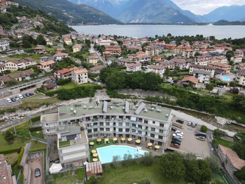 an aerial view of a resort with a town and a lake at Residence Alessandra Supervacanza - Domaso in Domaso