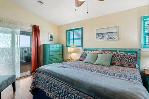 a bedroom with a large bed and a window at Bay Haven on Copano- 4 bdrm w/ 200+ft Fishing Pier in Rockport