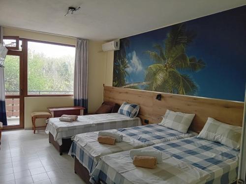 Llit o llits en una habitació de Guesthouse Oasis