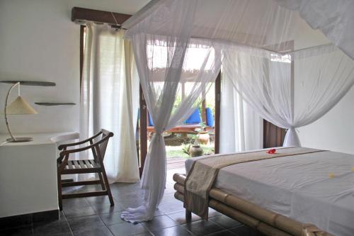 Giường trong phòng chung tại Villa Senang Senggigi