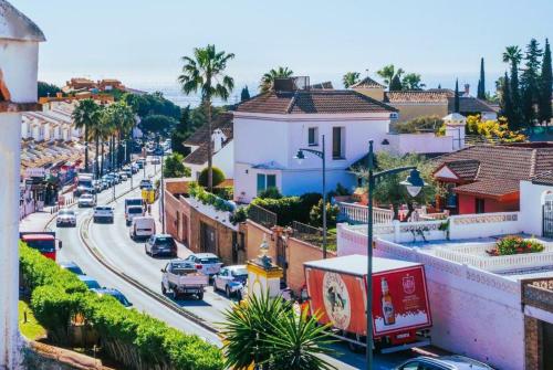 a view of a city street with cars and buildings at Casa Costa del Sol Beach&Golf,Marbella in Sitio de Calahonda