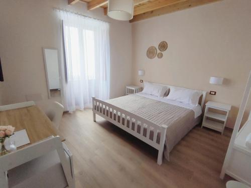 Postel nebo postele na pokoji v ubytování Donna Raffaela
