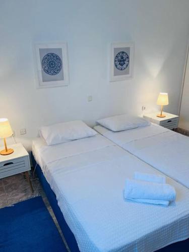 Postel nebo postele na pokoji v ubytování Akrata apartment