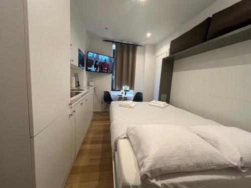 Cama o camas de una habitación en Royal Residence Lugano