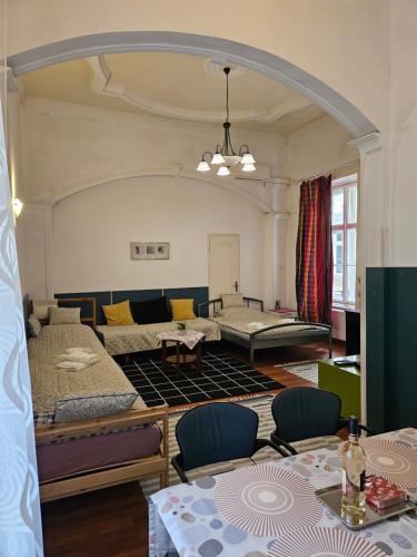a living room with several beds and a couch at Danube Bridge Apartments in Budapest