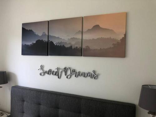 a sign on a wall with four pictures on it at Your little home in Hamburg Osdorf in Hamburg