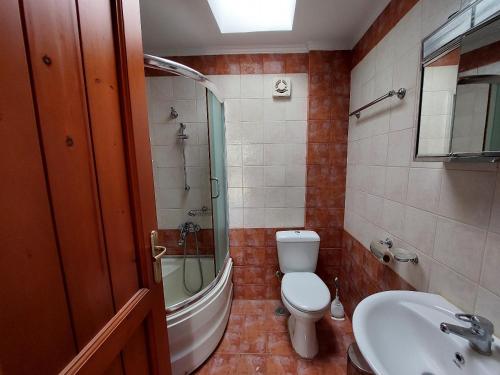 a bathroom with a toilet and a sink at Villa near Seitan Beach in Khordhákion
