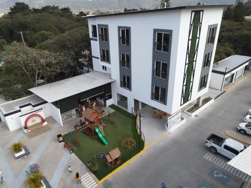an overhead view of a white building with a yard at Elithe Hotel in La Esperanza