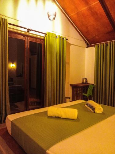 Ένα ή περισσότερα κρεβάτια σε δωμάτιο στο Sunshine Forest Lodge - Sinharaja