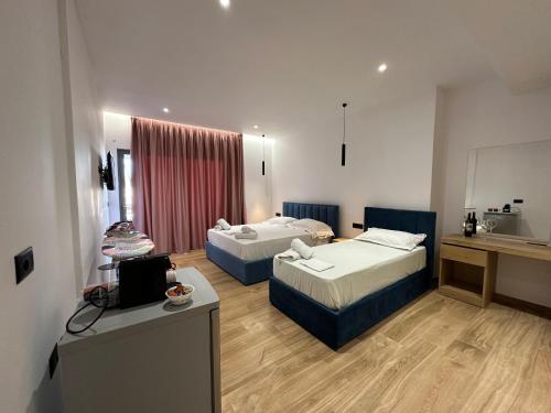 Postel nebo postele na pokoji v ubytování Suites Kozi