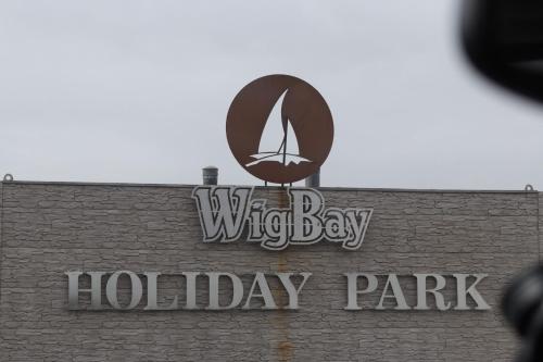 a sign on the top of a wydley bay holiday park at Bay 1 in Kirkcolm
