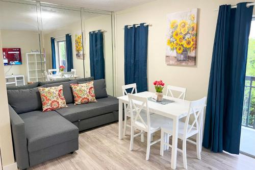 a living room with a couch and a table at Sunny Isles Apartments by MiaRentals in Sunny Isles Beach