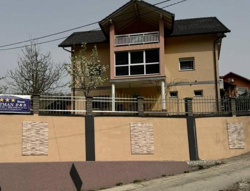 a large house on the side of a road at Apartman D&D in Jajce
