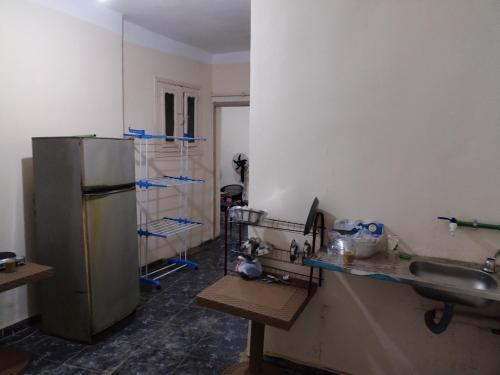 a kitchen is being remodeled with a refrigerator in it at USERSEEF in Cairo