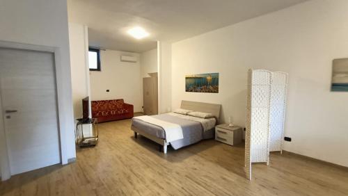 Ένα ή περισσότερα κρεβάτια σε δωμάτιο στο Intero alloggio, Binario 18