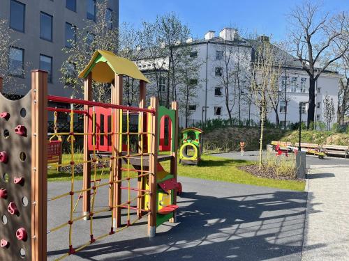 a playground in a park with a slide at Expo Apartment Kolejowa in Warsaw