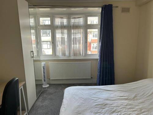 a bedroom with a bed and a window at 29 ansell road sw17 in London