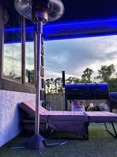 a purple bed in a room with a blue ceiling at Luxury Palace / Vacation Home in Alvin